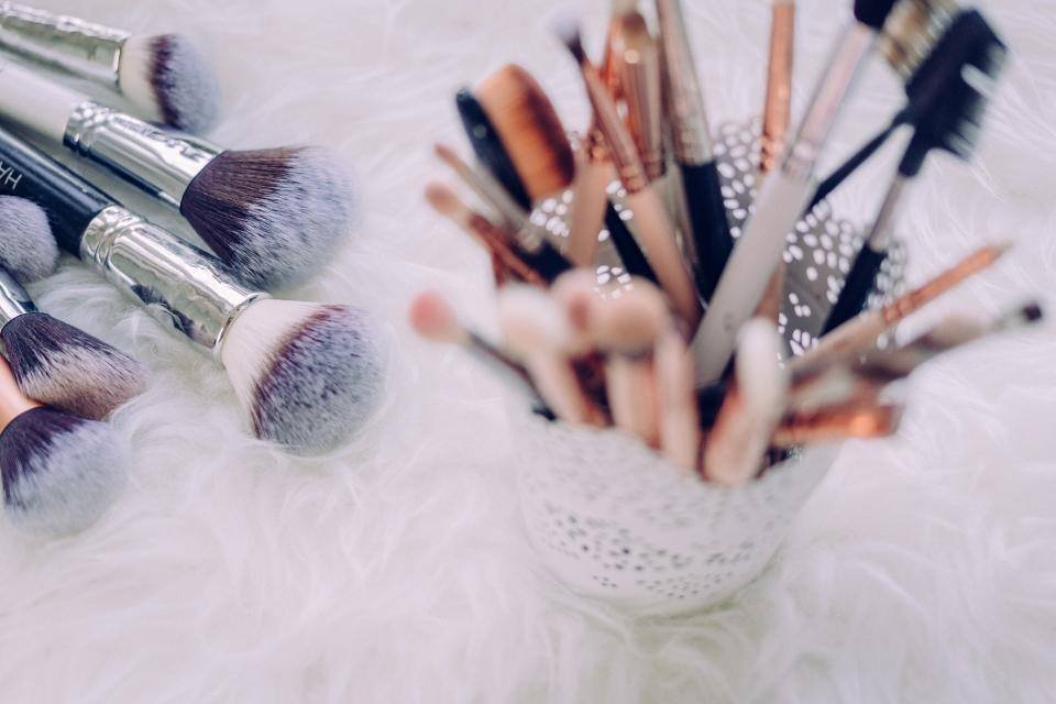 Makeup brushes on soft white fur