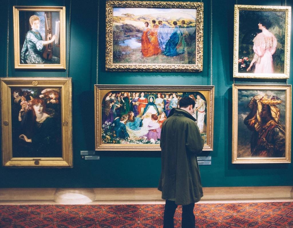 Framed paintings on a gallery wall