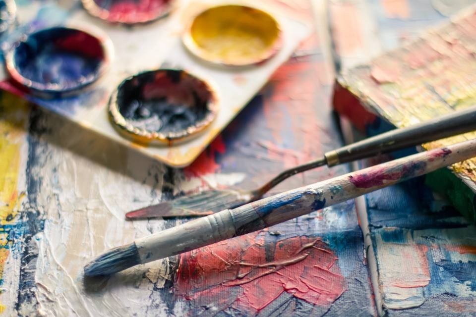 A paint palette with brushes