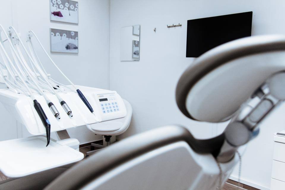 Dental instruments beside a treatment chair