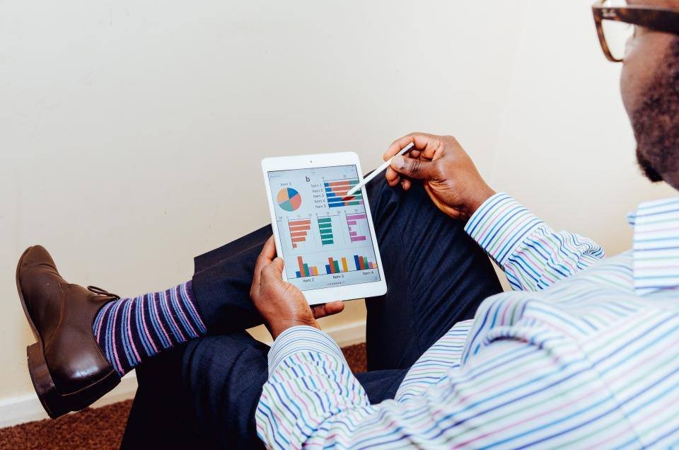 Reviewing business charts on a tablet