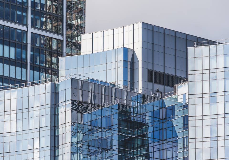 A cluster of modern glass buildings