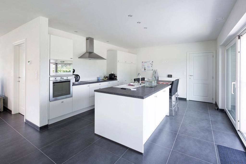 A white kitchen with an island