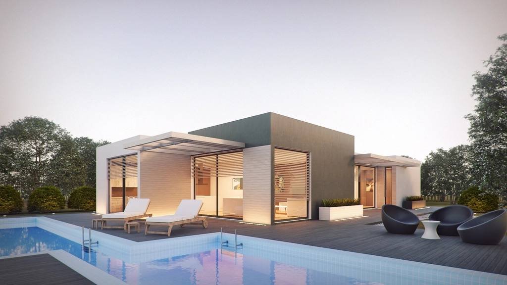 A modern villa with a swimming pool at dusk