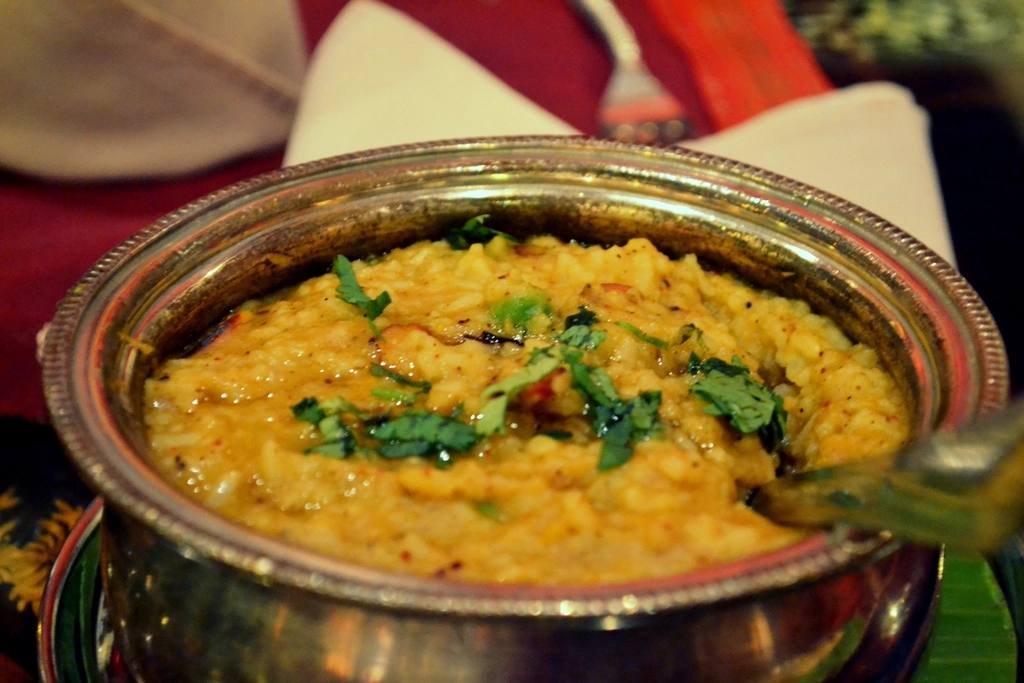 A bowl of dal garnished with fresh coriander